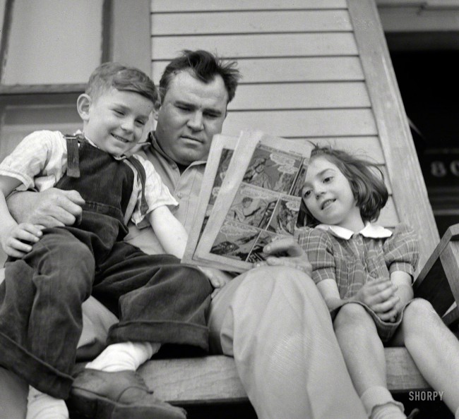 March 1943. Montgomery, Alabama. "Marvin Johnson, truck driver, reading the 'funnies' to his children." Happy Father's Day from Shorpy! Photo by John Vachon for the Office of War Information.